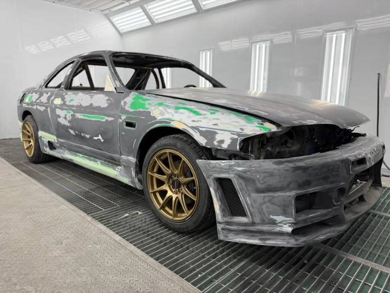 Nissan Skyline with old paint stripped back to bare panels at Platinum One Auto, Al Quoz