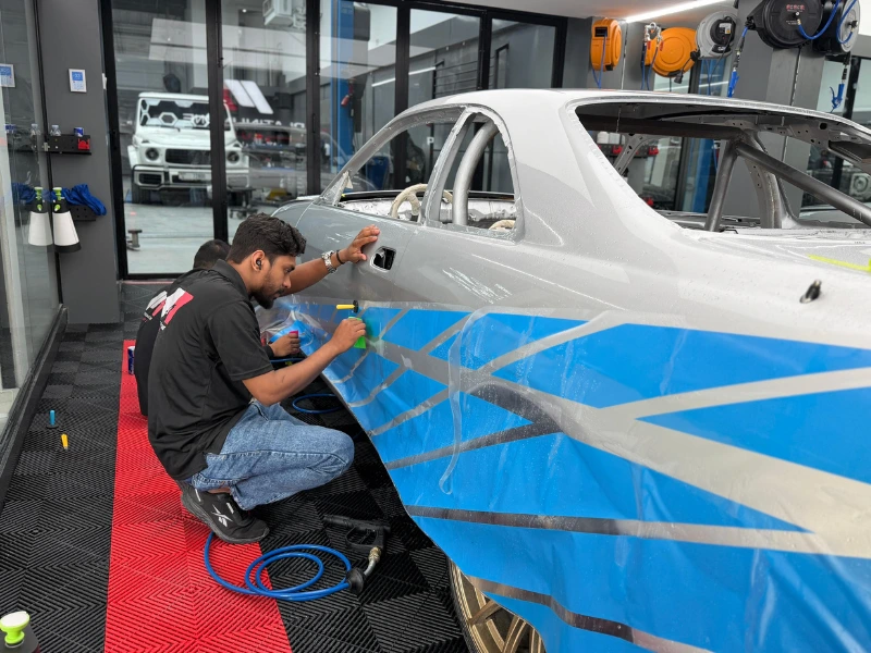Nissan Skyline freshly painted, ready for vinyl wrap and decal install at Platinum One Auto, Al Quoz