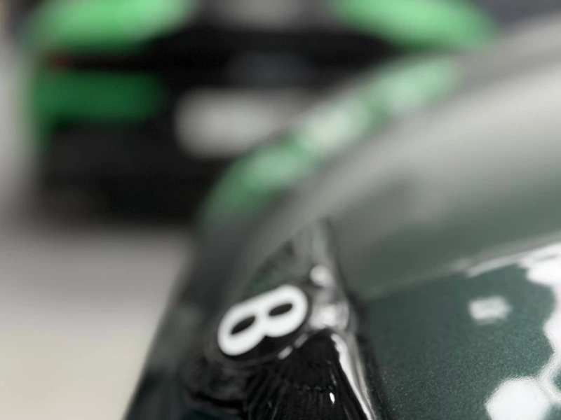 Bentley badge close up in woprkshop